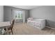 Cozy bedroom with built-in storage under the bed, a desk, and ample natural light at 9950 Sugarleaf Pl, Fishers, IN 46038