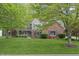 Charming two-story home featuring a landscaped yard and inviting front porch at 9950 Sugarleaf Pl, Fishers, IN 46038