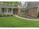 Charming entryway with a landscaped yard and beautiful brick and gray siding at 9950 Sugarleaf Pl, Fishers, IN 46038