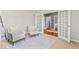 Bright and airy living room featuring neutral paint, two white chairs, and light carpet at 9950 Sugarleaf Pl, Fishers, IN 46038