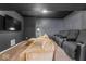 Cozy home theater with comfortable seating and a large screen for immersive entertainment at 9950 Sugarleaf Pl, Fishers, IN 46038