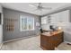 Neutral office featuring bright natural light, a ceiling fan, and a wood desk at 9950 Sugarleaf Pl, Fishers, IN 46038