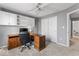 This office features built in cabinets, a ceiling fan, and a functional layout for productivity at 9950 Sugarleaf Pl, Fishers, IN 46038