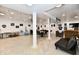 Large finished basement featuring diverse recreational areas, including a game table, seating, and wall decor at 998 Cass Dr, Franklin, IN 46131