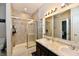 Clean bathroom with a double vanity sink, tile flooring, and glass shower with tiled walls at 998 Cass Dr, Franklin, IN 46131