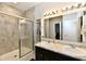Bright bathroom with a double sink vanity, tile flooring, and glass shower at 998 Cass Dr, Franklin, IN 46131