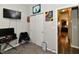 Comfortable bedroom featuring TV, artwork, closet and doorway to another room at 998 Cass Dr, Franklin, IN 46131