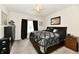 Comfortable bedroom featuring a wooden bed frame, soft carpeting, and natural light from the window at 998 Cass Dr, Franklin, IN 46131