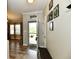 Inviting home foyer with modern flooring, a 'Gather' wall decor, and an abundance of natural light at 998 Cass Dr, Franklin, IN 46131
