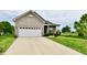 Attractive home with a two-car garage, well-kept lawn, and a welcoming front entrance at 998 Cass Dr, Franklin, IN 46131