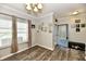 Bright living room featuring modern flooring, a blue front door, and neutral wall colors at 998 Cass Dr, Franklin, IN 46131