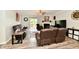 Comfortable living room features hardwood floors, a fireplace, and leather reclining sofas at 998 Cass Dr, Franklin, IN 46131