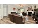 Inviting living room features hardwood floors, a fireplace, and comfortable leather seating at 998 Cass Dr, Franklin, IN 46131