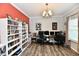 Bright home office with a bookshelf, neutral wall colors, and a spacious desk setup at 998 Cass Dr, Franklin, IN 46131