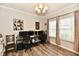 Spacious home office with modern flooring, neutral walls, and a large desk setup for multiple monitors at 998 Cass Dr, Franklin, IN 46131