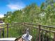 Charming balcony with lovely outdoor decor, perfect for enjoying the lush green surroundings and a peaceful retreat at 1026 Jackson St, Columbus, IN 47201