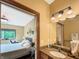 Charming bathroom leading to a bright bedroom, offering a seamless and stylish transition at 1026 Jackson St, Columbus, IN 47201