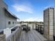 Spacious rooftop deck with a bar area and outdoor seating offering stunning views at 1026 Jackson St, Columbus, IN 47201
