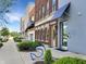 Beautiful townhome featuring brick and modern siding, with bike parking in a landscaped yard at 1026 Jackson St, Columbus, IN 47201