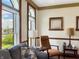 Inviting living room featuring large windows, cozy seating, and elegant decor at 1026 Jackson St, Columbus, IN 47201