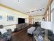 Spacious living area with hardwood floors, comfortable seating, and a modern entertainment center at 1026 Jackson St, Columbus, IN 47201
