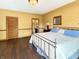 Inviting bedroom featuring a king bed, with a view of the ensuite bathroom, offering a blend of comfort and convenience at 1026 Jackson St, Columbus, IN 47201