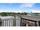 Cozy rooftop deck with a wooden bar, stools, and neighborhood views at 1026 Jackson St, Columbus, IN 47201
