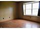 Bedroom with light-colored walls, wood-look flooring, a ceiling fan and bright window at 107 Camelia Ct, Mooresville, IN 46158