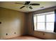 Bedroom with laminate floors, a ceiling fan and a bright window at 107 Camelia Ct, Mooresville, IN 46158