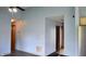 A look inside the living room showcasing light blue walls and view into a hallway with wooden doors at 107 Camelia Ct, Mooresville, IN 46158