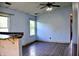The living room features wood-look flooring, light blue walls and access to other rooms at 107 Camelia Ct, Mooresville, IN 46158