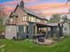 The back exterior features a patio, deck, and large windows, offering ample natural light at 11064 Hamilton Run, Zionsville, IN 46077