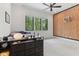 Bedroom featuring a basketball hoop accent wall and a large window view at 11064 Hamilton Run, Zionsville, IN 46077