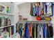 Organized closet with shelving, hanging clothes, and display items at 11064 Hamilton Run, Zionsville, IN 46077