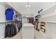 Spacious walk in closet with organized shelving and island at 11064 Hamilton Run, Zionsville, IN 46077