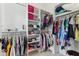 Organized walk-in closet with clothing racks, shelves, and storage for accessories in a clean, well-lit space at 11064 Hamilton Run, Zionsville, IN 46077