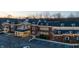 A brick apartment building with holiday decor, well-lit entryways, and accessible parking spaces at 11064 Hamilton Run, Zionsville, IN 46077