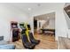 Game room with arcade games, comfy chairs, and a view into the billiards room at 11064 Hamilton Run, Zionsville, IN 46077