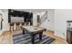 Entertaining game room with a pool table, bar, and walkout access, perfect for social gatherings at 11064 Hamilton Run, Zionsville, IN 46077