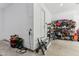 Organized garage area with storage shelves, equipment, and easy access to the main house at 11064 Hamilton Run, Zionsville, IN 46077