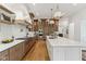 Gourmet kitchen with a large island, modern lighting, and stainless steel appliances at 11064 Hamilton Run, Zionsville, IN 46077