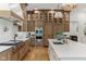 Luxury kitchen featuring stainless steel appliances, wood floors, and custom cabinets at 11064 Hamilton Run, Zionsville, IN 46077