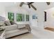 Bright primary bedroom with scenic backyard views, vaulted ceiling and contemporary ceiling fan at 11064 Hamilton Run, Zionsville, IN 46077