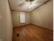An inviting bedroom featuring gleaming hardwood floors and natural light at 117 Fountain Lake Dr, Greenfield, IN 46140