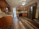 Updated kitchen with stainless steel appliances and sleek flooring at 117 Fountain Lake Dr, Greenfield, IN 46140