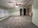 Bright and open living room with neutral walls and plush carpeting at 117 Fountain Lake Dr, Greenfield, IN 46140