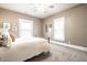 Bedroom with neutral color palette, natural lighting, and comfortable bed at 1205 N Oxford St, Indianapolis, IN 46201