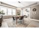 Dining room with modern light fixture, wood table, and decorative rug in a neutrally painted space at 1205 N Oxford St, Indianapolis, IN 46201