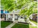 Quaint two-story home with a cozy front porch and well-kept landscaping, perfect for families at 1205 N Oxford St, Indianapolis, IN 46201