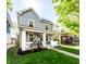 Charming home with manicured lawn, inviting porch, and gray siding, perfect for curb appeal at 1205 N Oxford St, Indianapolis, IN 46201